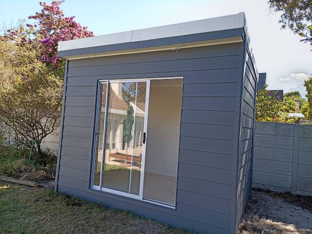 Contemporary gray modular house with large glass doors
